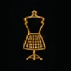 Golden dress form on black background.