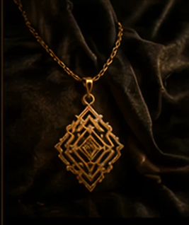Gold geometric pendant on dark fabric background.