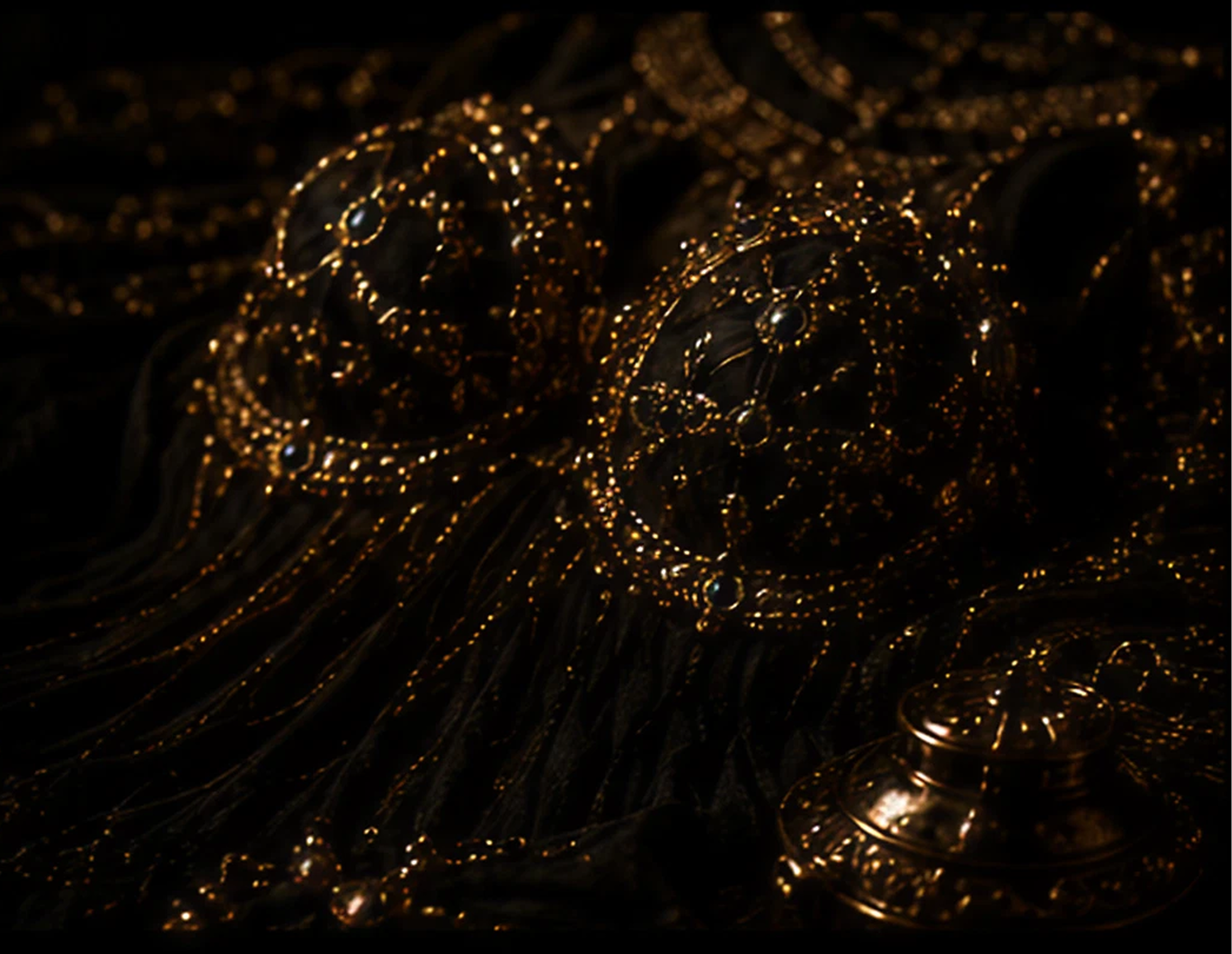 Ornate jeweled garment with intricate golden details.